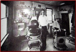 LaGrange Wyoming history - Cletis Arnold in his barber shop early 1930s