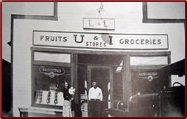 Wyoming State History - Lloyd & Lila Craton in front of their grocery store, 1930s